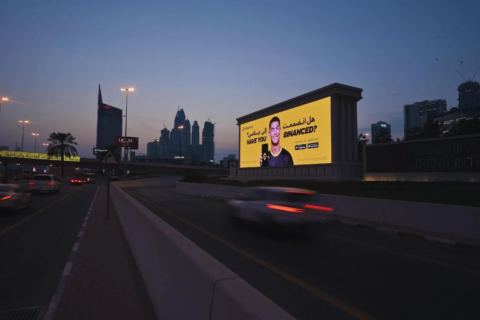 Digital billboard on Sheikh Zayed Road at dusk